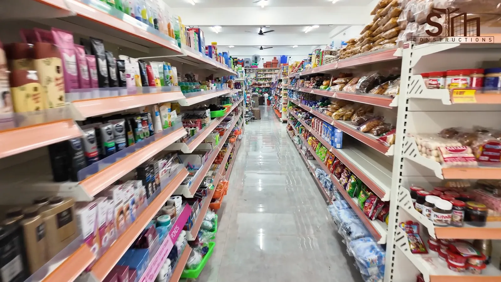 Stocked shelving aisles inside the supermarket in Modakkurichi, Erode