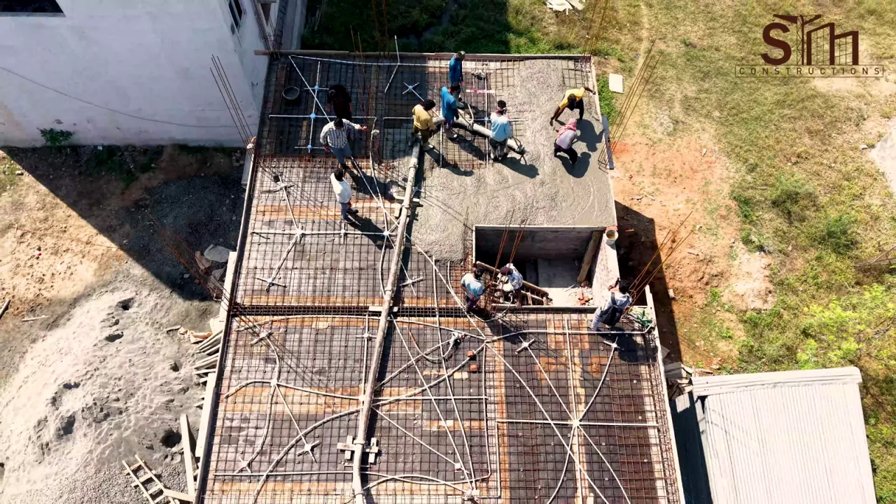 Aerial view of the roof-slab concrete pour in Muthampalayam, Erode