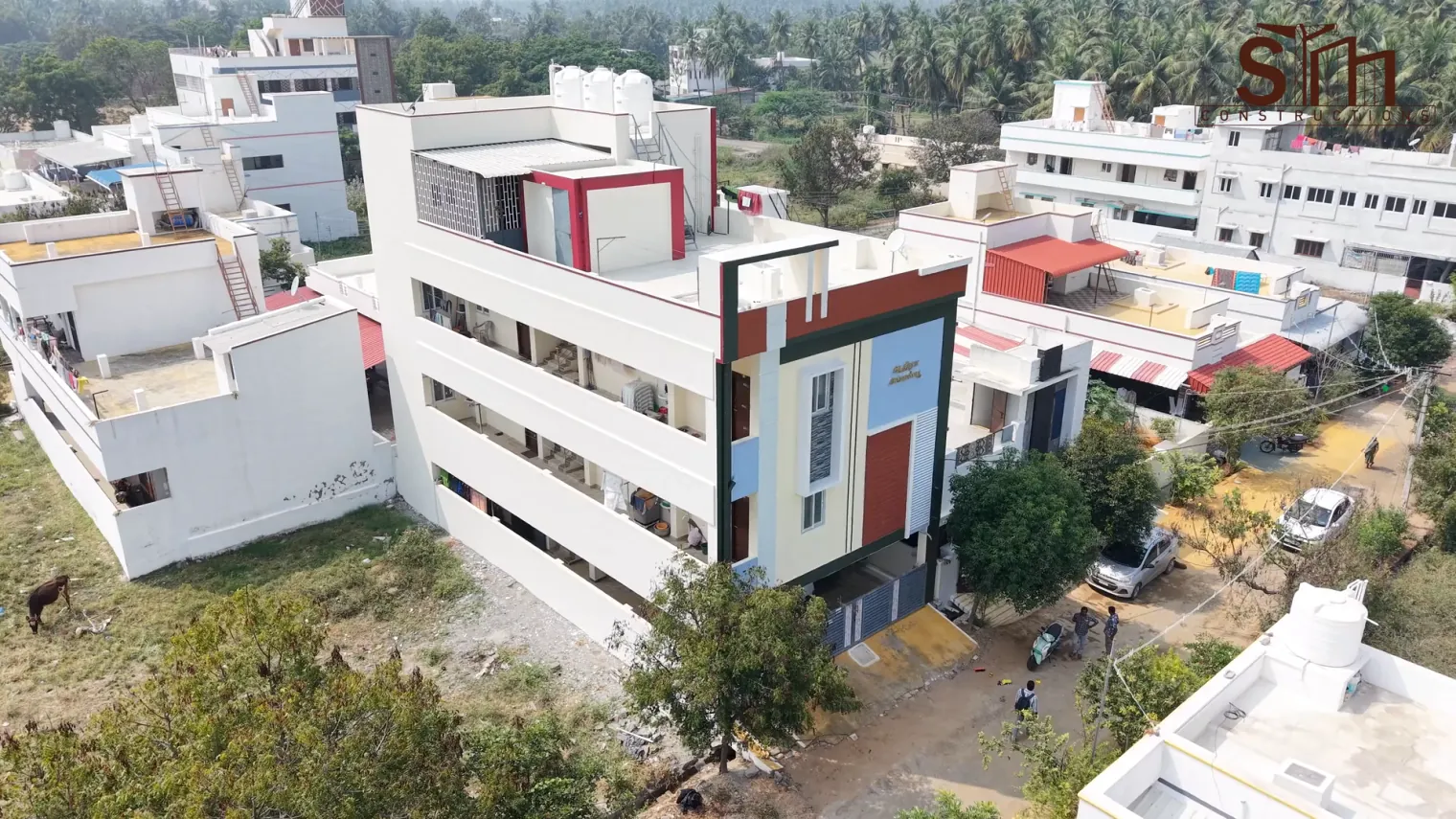 Aerial view of the coloured facade at Udhayam Garden, Modakkurichi, Erode