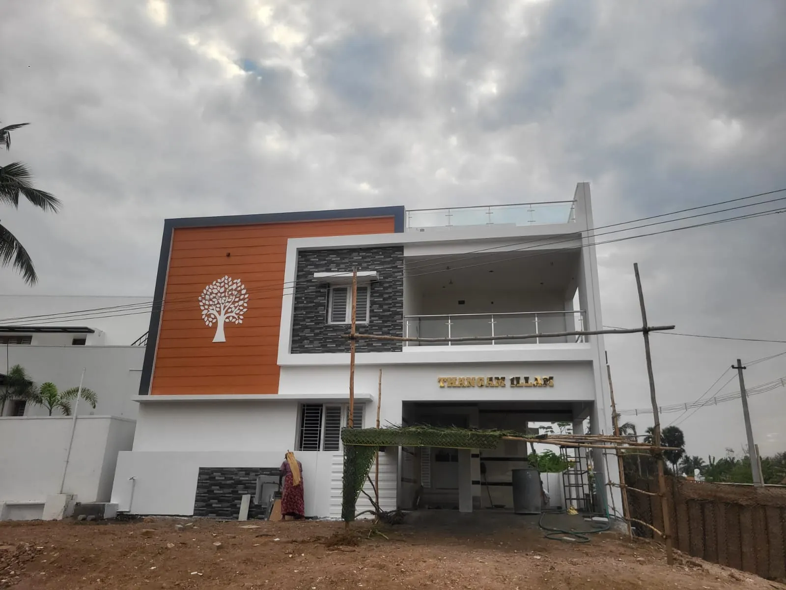 Coloured residential facade at Udhayam Garden, Modakkurichi, Erode